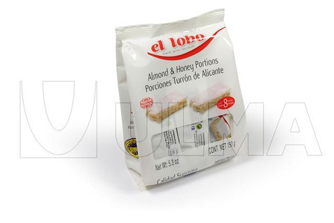 Porzioni di torrone in macchina verticale con fondo stabile e film laminato.